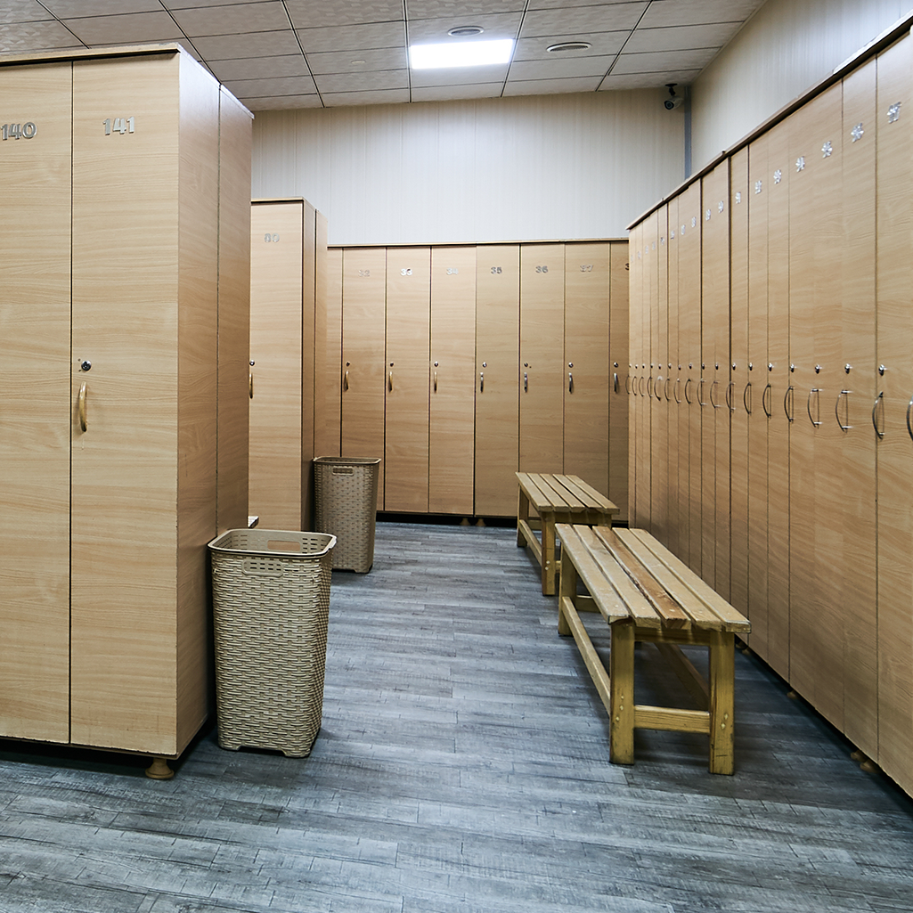 Wooden-lockers-with-a-wood-bench-in-a-locker-room-938277428_1025x1025