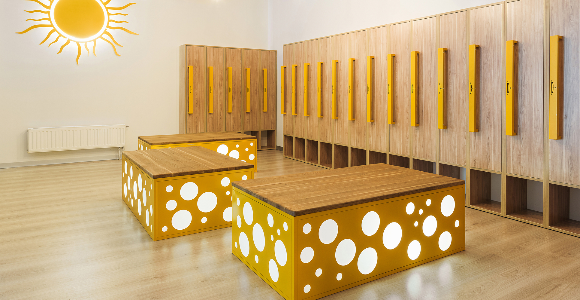 wooden-lockers-in-modern-illuminated-kindergarten-cloakroom-1062087842_1932x998